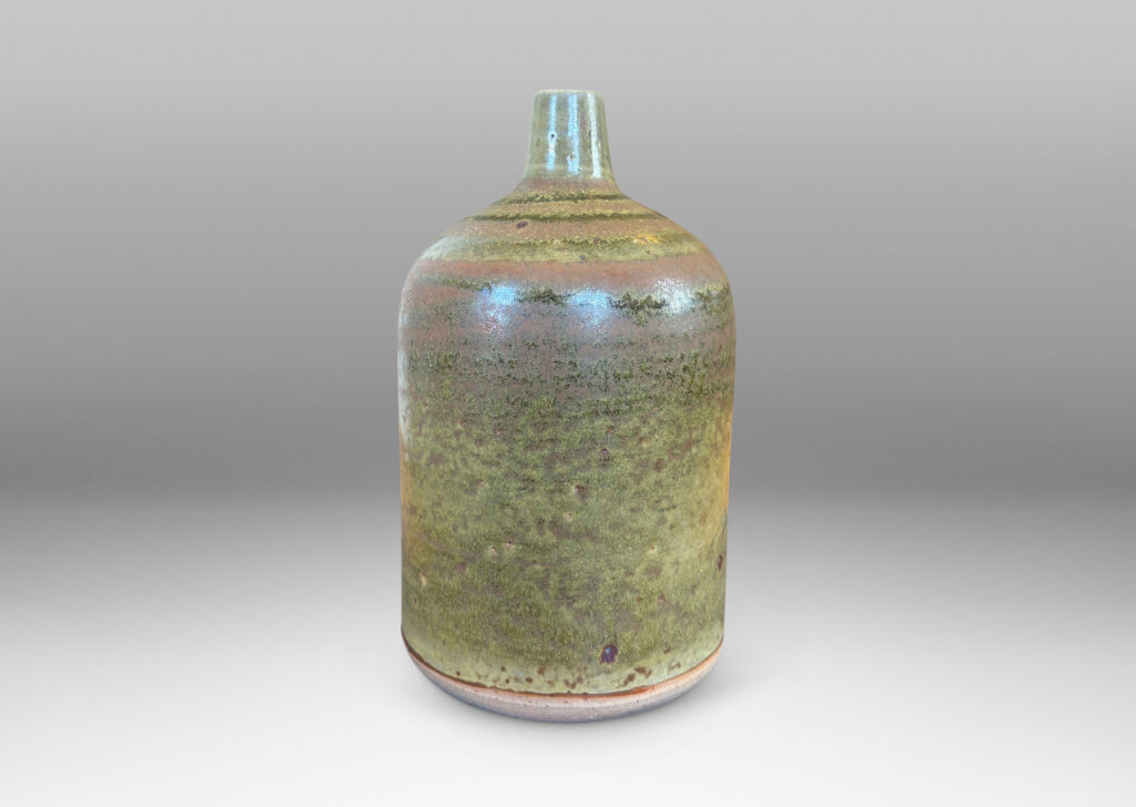 Gallery BAC cylindrical form with a narrow sprouting neck, glazed in atmospheric matte brown and shiny olive green