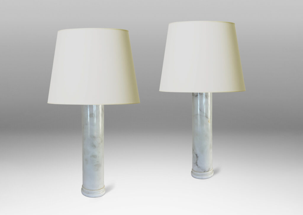Gallery BAC cylindrical form with stepped disk plinth; lathed solid marble in white with gray graining