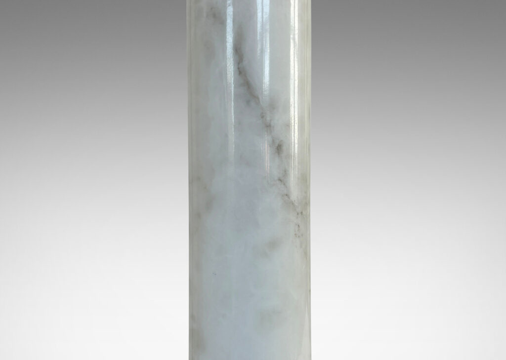 Gallery BAC cylindrical form with stepped disk plinth; lathed solid marble in white with gray graining