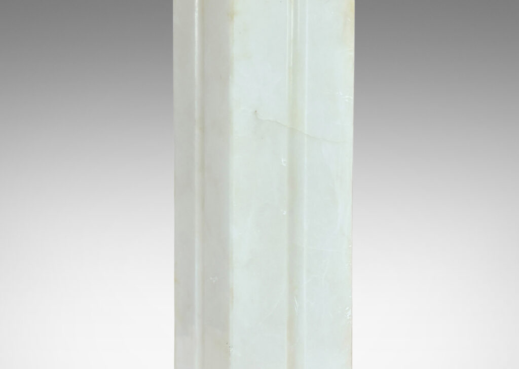 Gallery BAC square pillar form with vertical carved bands on each face; lathed solid marble in white with gray graining