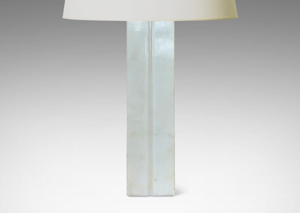 Gallery BAC square pillar form with vertical carved bands on each face; lathed solid marble in white with gray graining