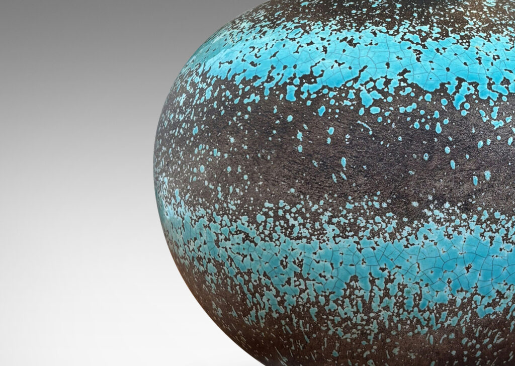 Gallery BAC dynamically modeled tapering spherical form, glazed in ethereal turquoise stripes against matte gray