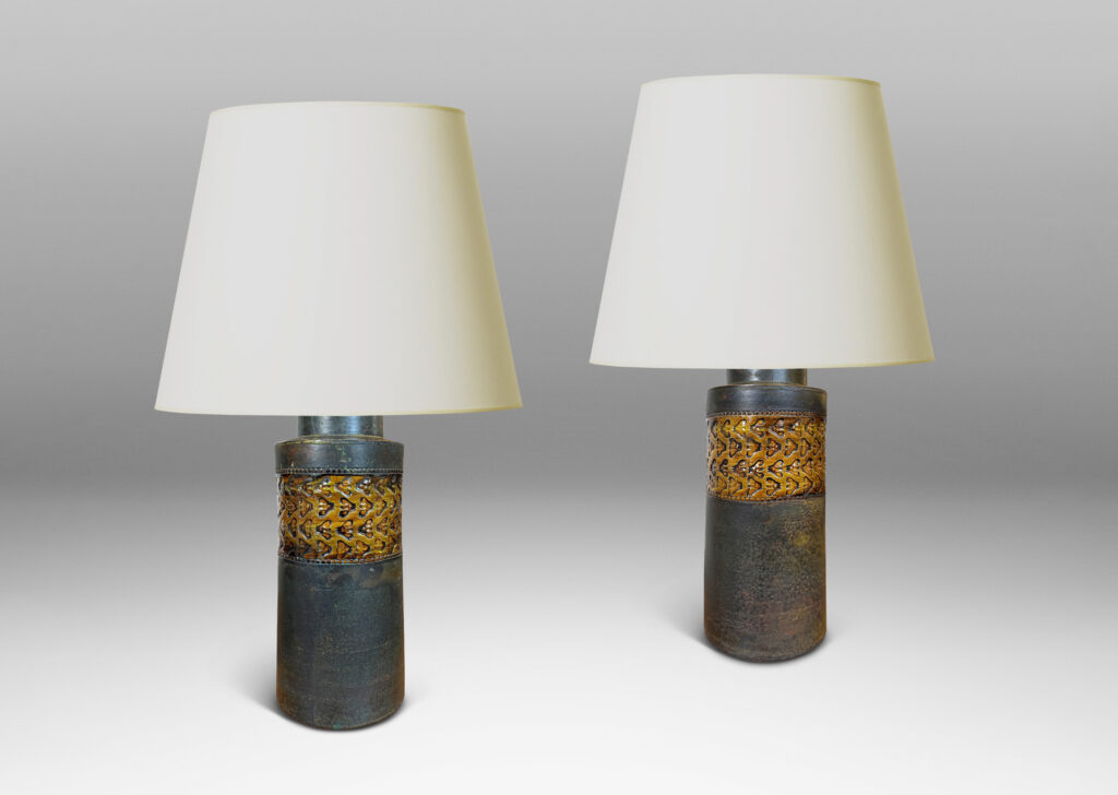 Gallery BAC rationalized canister form in matte brown, with wide bands with impressed ornaments glazed in a gloss coffee brown