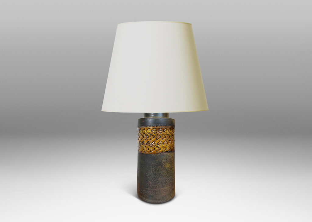 Gallery BAC rationalized canister form in matte brown, with wide bands with impressed ornaments glazed in a gloss coffee brown