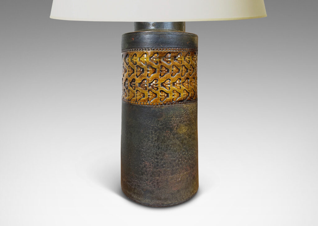Gallery BAC rationalized canister form in matte brown, with wide bands with impressed ornaments glazed in a gloss coffee brown