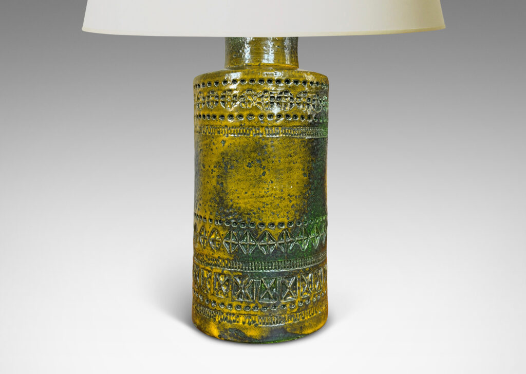 Gallery BAC medium height cylindrical form encircled in bands of impressed geometric ornaments, glazed in mustard yellow with green-gray