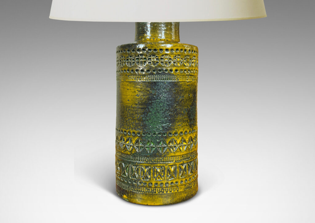 Gallery BAC medium height cylindrical form encircled in bands of impressed geometric ornaments, glazed in mustard yellow with green-gray