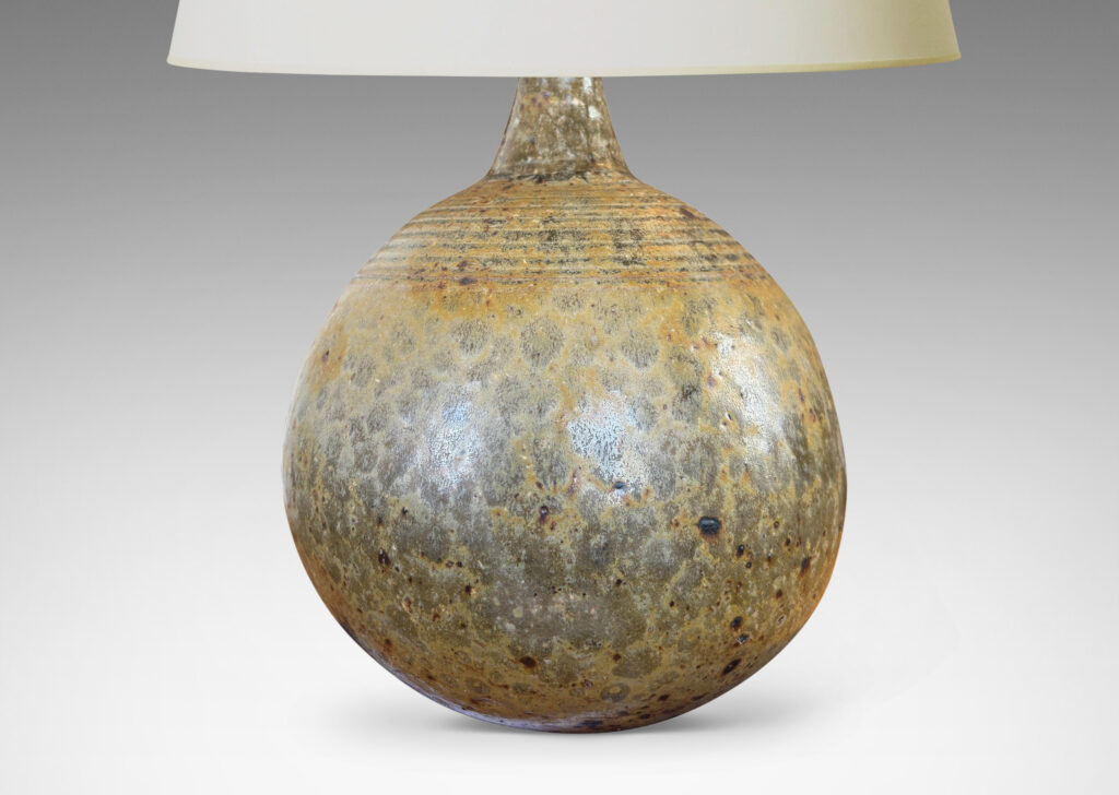 Gallery BAC blump globe form with carved rings on top and sprouting neck, glazed in pale taupe and gray