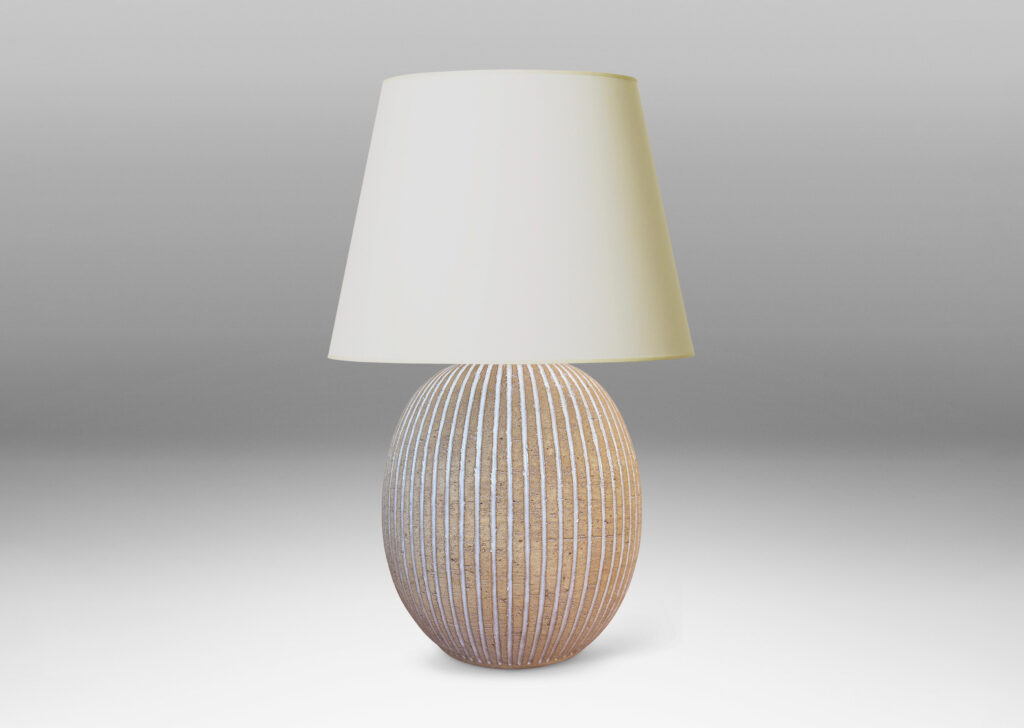 Gallery BAC light tan ovoid form with carved and white-glazed vertical pinstripes