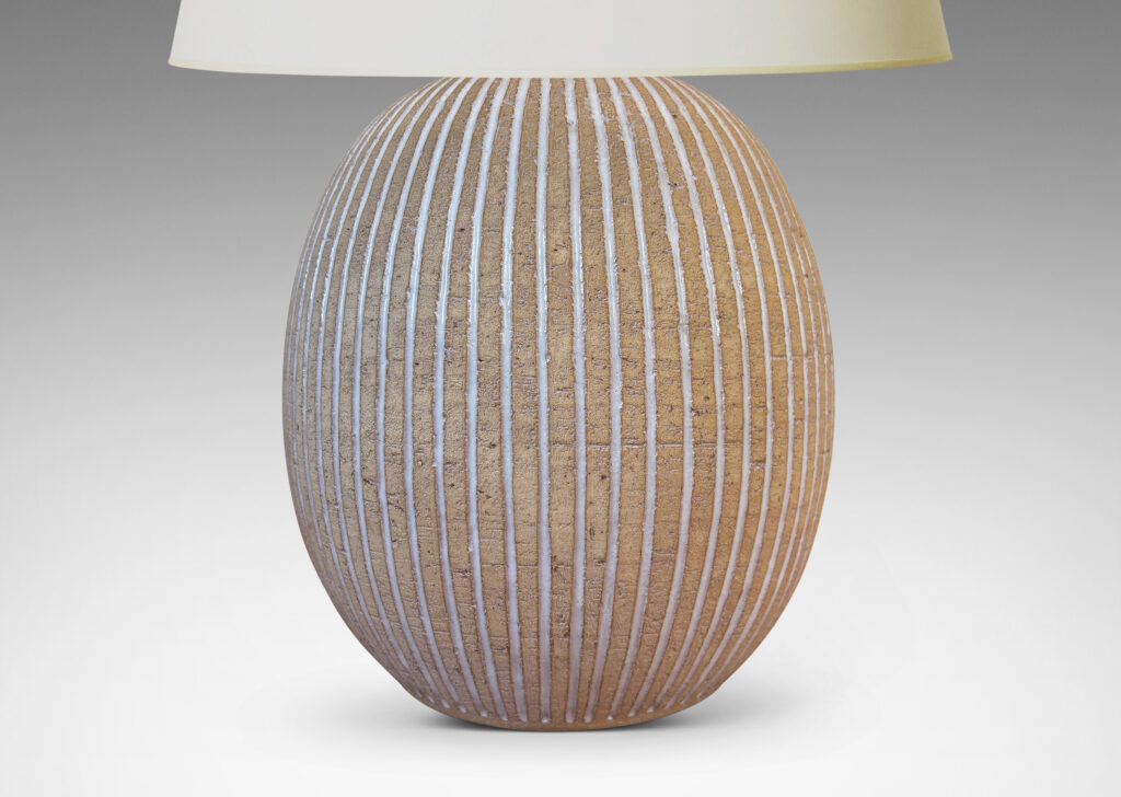 Gallery BAC light tan ovoid form with carved and white-glazed vertical pinstripes