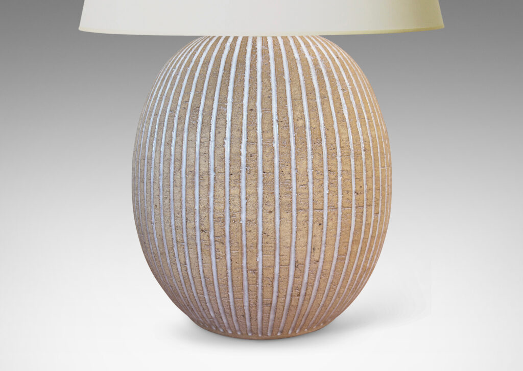 Gallery BAC light tan ovoid form with carved and white-glazed vertical pinstripes