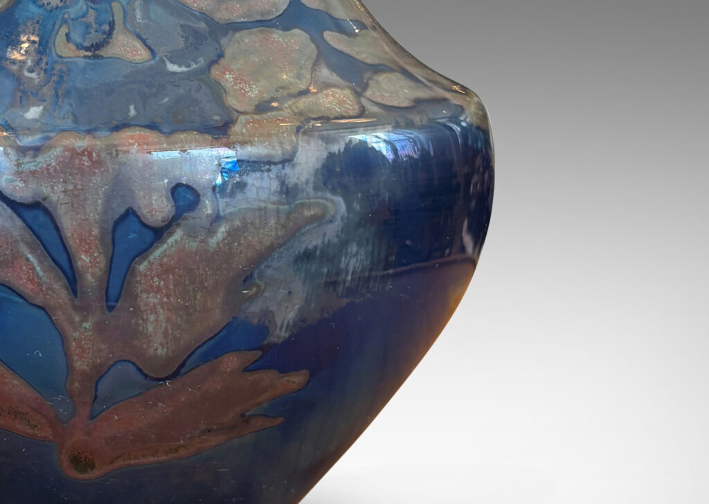 Gallery BAC wide tapered globe form with coved shoulders, glazed in blue-gray luster with red luster floral design
