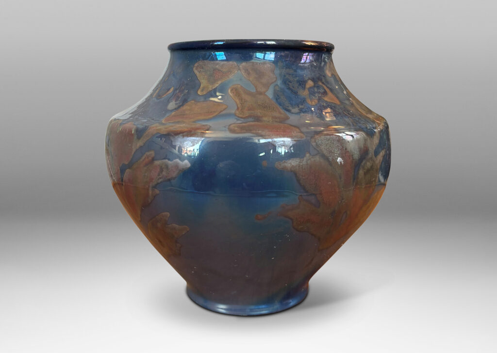Gallery BAC wide tapered globe form with coved shoulders, glazed in blue-gray luster with red luster floral design
