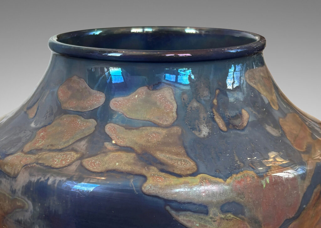 Gallery BAC wide tapered globe form with coved shoulders, glazed in blue-gray luster with red luster floral design