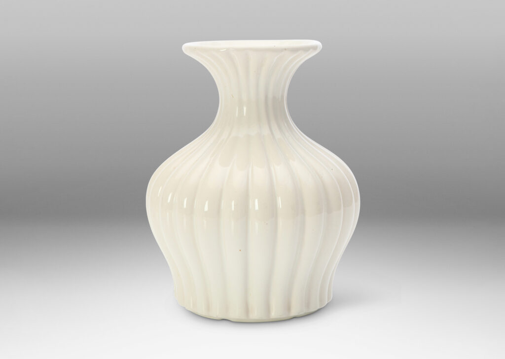 Gallery BAC reeded swelling form with sprouting mouth in a gloss white glaze