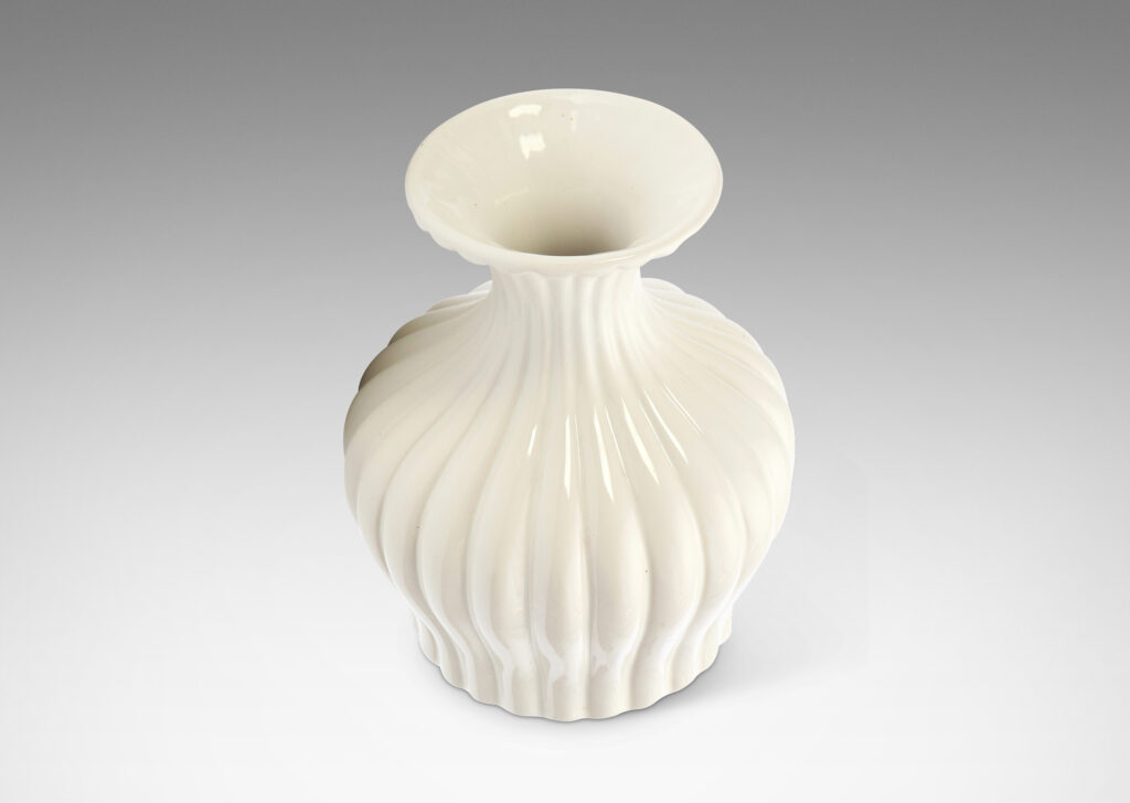 Gallery BAC reeded swelling form with sprouting mouth in a gloss white glaze