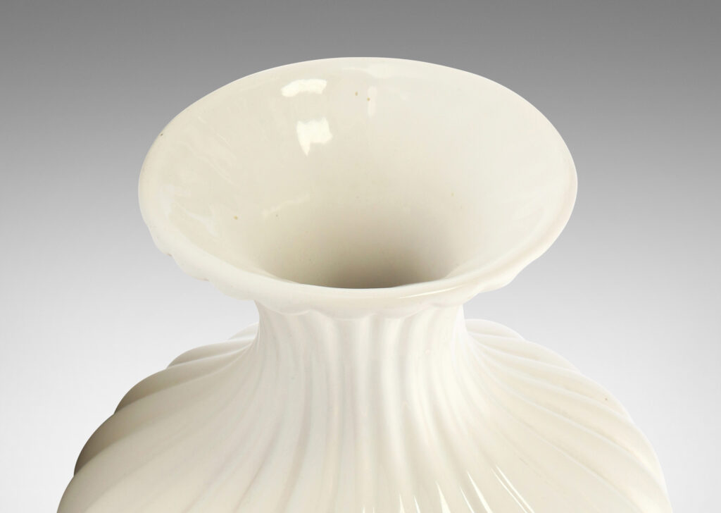 Gallery BAC reeded swelling form with sprouting mouth in a gloss white glaze