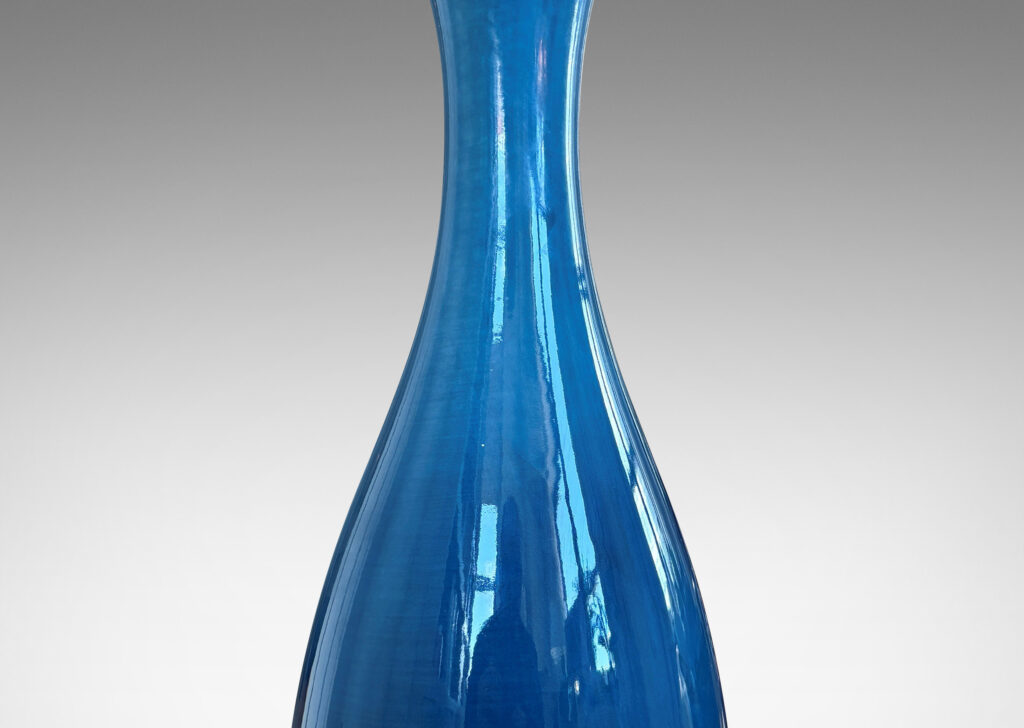 Gallery BAC slim sinuously modeled form glazed in a shiny savoy blue