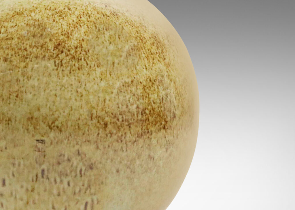 Gallery BAC globe form glazed in a beachy stipple dark over pale brown