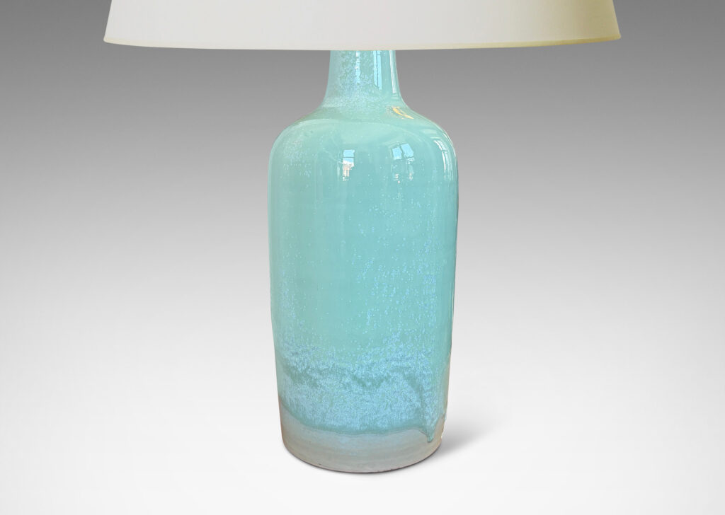 Gallery BAC tall tapered form glazed in a thick celadon tone with speckling and nice flow line at base