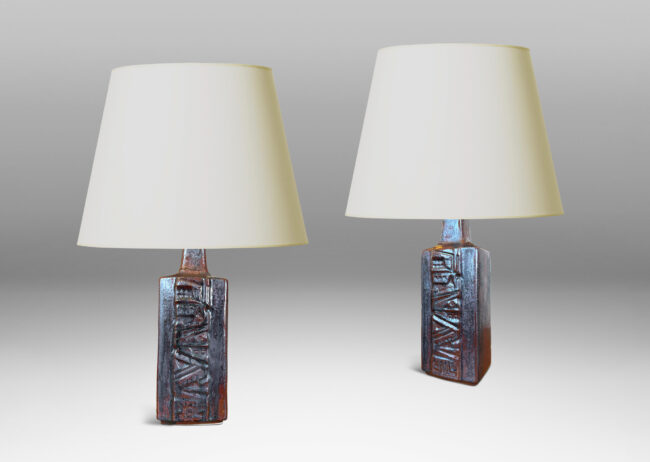 Gallery BAC rectangular bottle form with wide bands of geometric ornament in relief, glazed in an oxblood with gray glaze