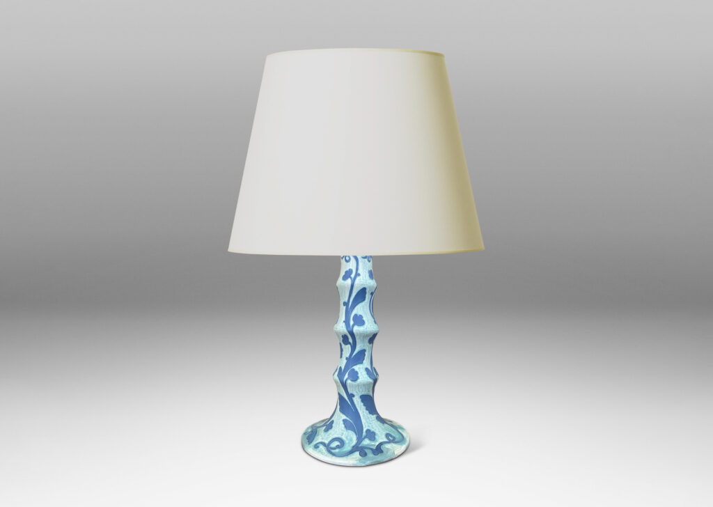 Gallery BAC tiered stand and round base, with carved floral pattern in French blue against pale cerulean