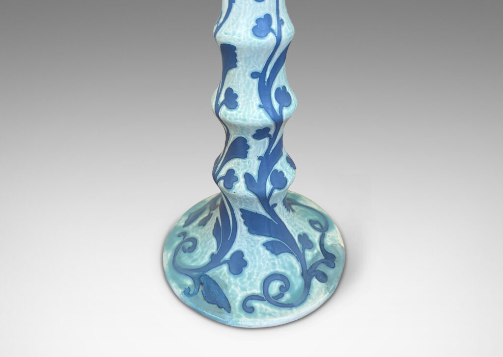 Gallery BAC tiered stand and round base, with carved floral pattern in French blue against pale cerulean