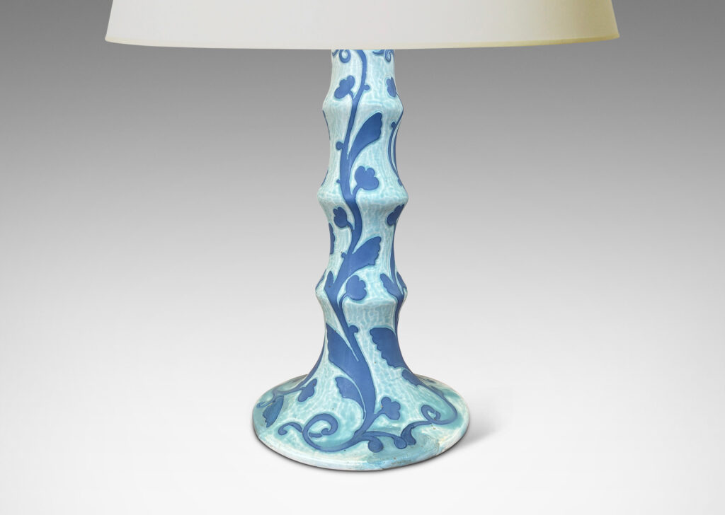 Gallery BAC tiered stand and round base, with carved floral pattern in French blue against pale cerulean