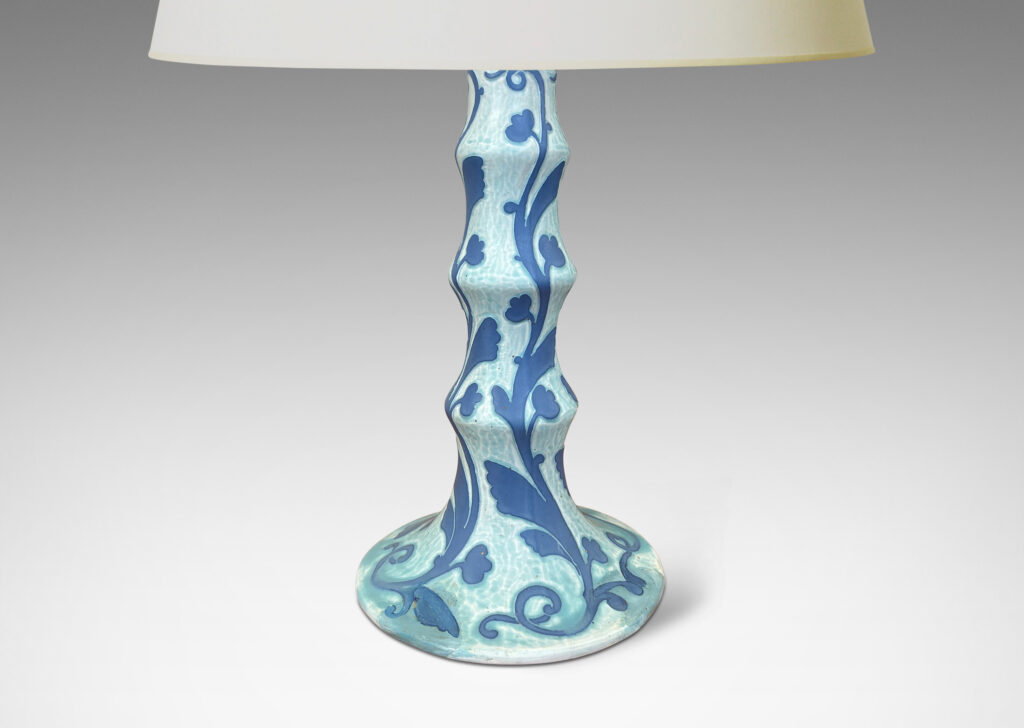 Gallery BAC tiered stand and round base, with carved floral pattern in French blue against pale cerulean