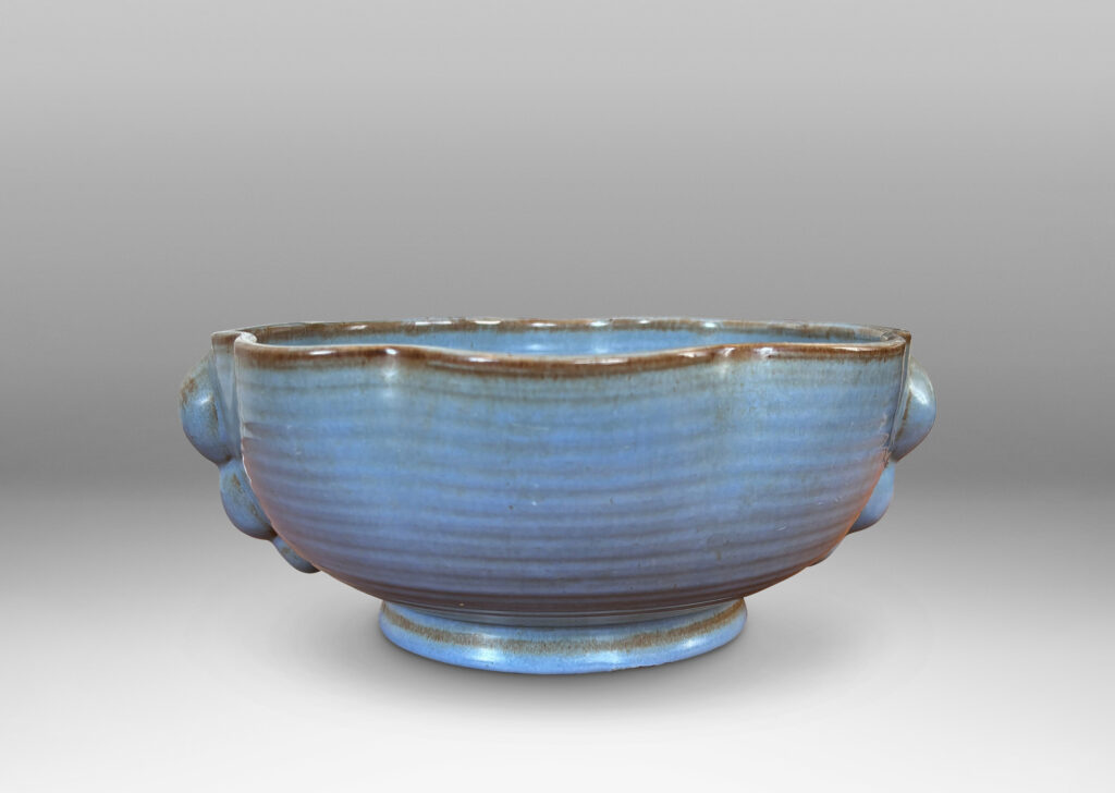 Gallery BAC lobed lip, ridged surfaces, and bubble handles, glazed in a cornflower blue with brown accents