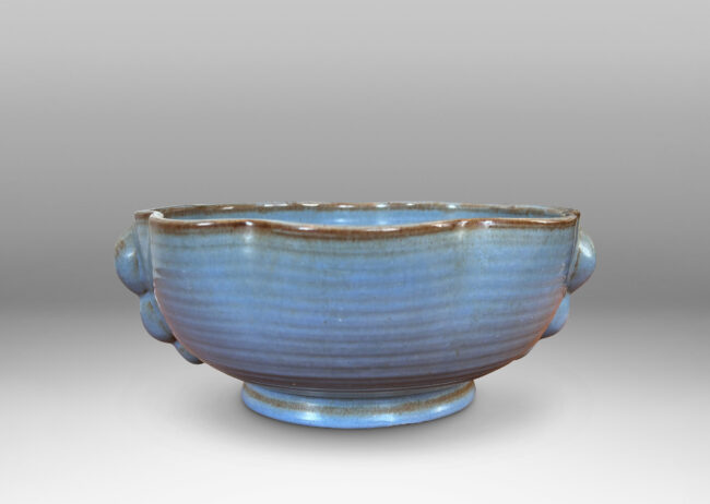 Gallery BAC lobed lip, ridged surfaces, and bubble handles, glazed in a cornflower blue with brown accents
