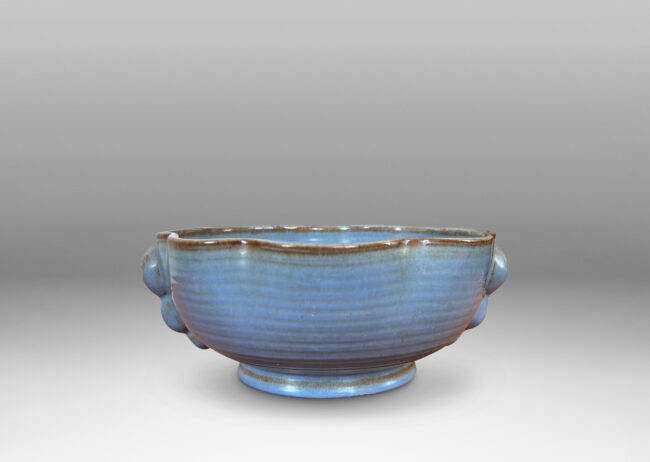 Gallery BAC lobed lip, ridged surfaces, and bubble handles, glazed in a cornflower blue with brown accents