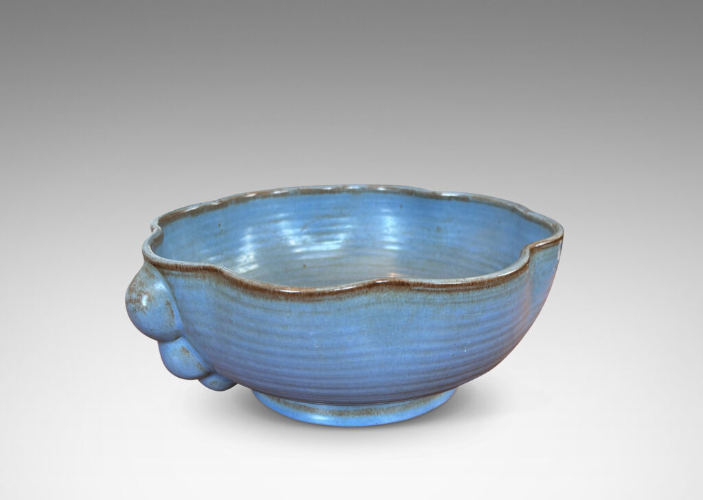 Gallery BAC lobed lip, ridged surfaces, and bubble handles, glazed in a cornflower blue with brown accents
