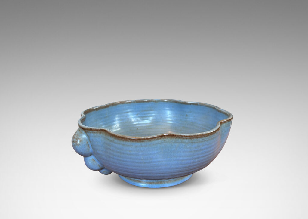 Gallery BAC lobed lip, ridged surfaces, and bubble handles, glazed in a cornflower blue with brown accents