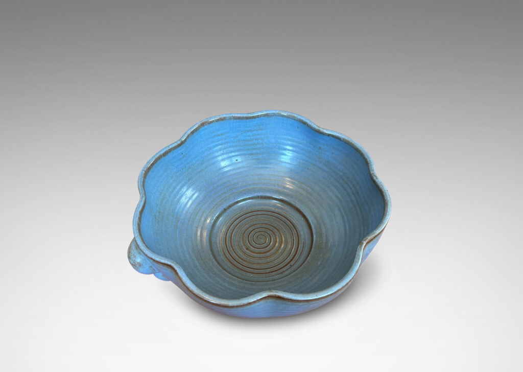 Gallery BAC lobed lip, ridged surfaces, and bubble handles, glazed in a cornflower blue with brown accents