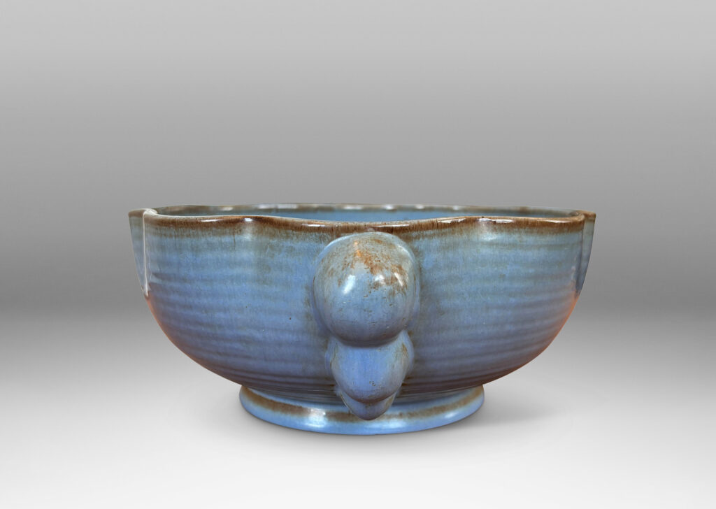 Gallery BAC lobed lip, ridged surfaces, and bubble handles, glazed in a cornflower blue with brown accents