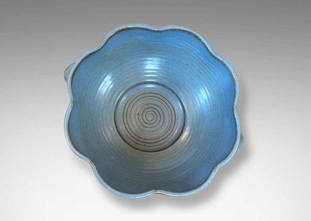 Gallery BAC lobed lip, ridged surfaces, and bubble handles, glazed in a cornflower blue with brown accents