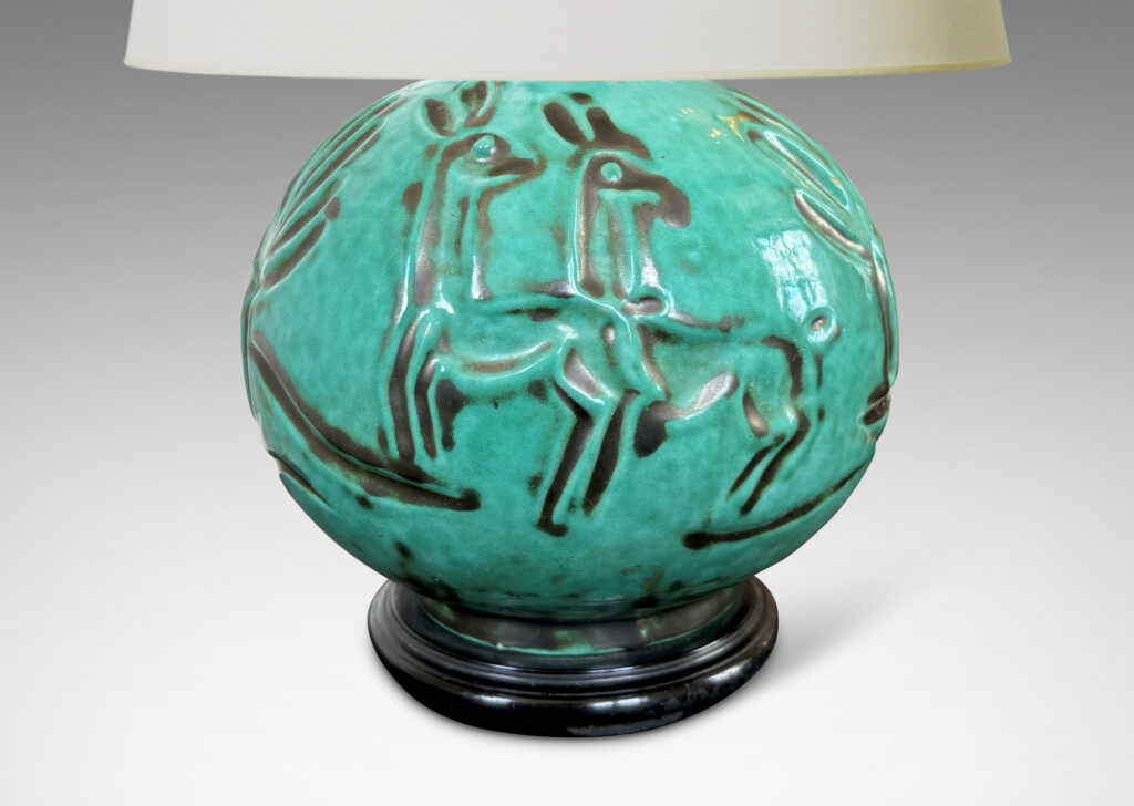 Gallery BAC plump globe form with carved countryside figures of animals, farmers and trees, in a tonal teal copper oxide glaze