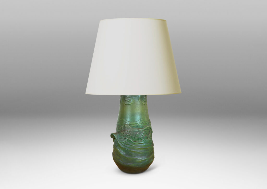 Gallery BAC bell-like form encircled in reliefs depicting waves, fish, mermaids and cloud ball motifs, glazed in a matte dark green