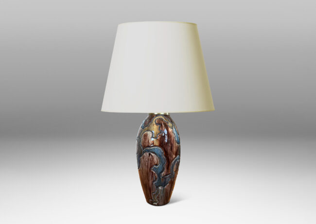 Gallery BAC carved design of scalloped forms, glazed in dark brown, blue and light raw umber