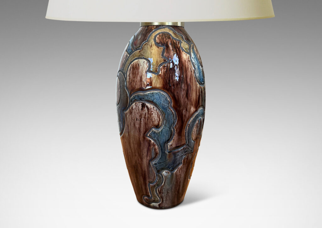 Gallery BAC carved design of scalloped forms, glazed in dark brown, blue and light raw umber