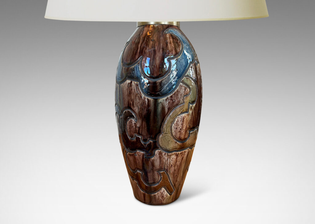 Gallery BAC carved design of scalloped forms, glazed in dark brown, blue and light raw umber
