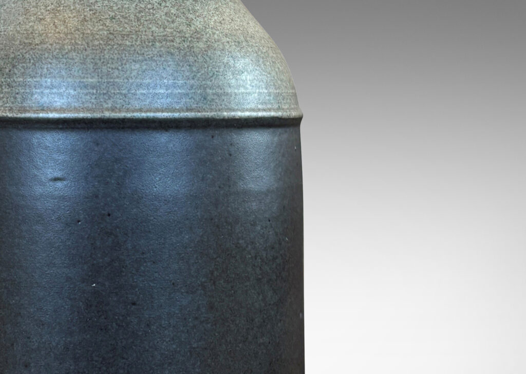 Gallery BAC cylindrical form with rounded corners and notched mouths, glazed in dark brown and gray