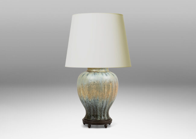 Gallery BAC swelling form glazed in a spectacular flowing ice blue, olive and blue-black, with very fine patinated base with ball feet and top with floating filigree rosette