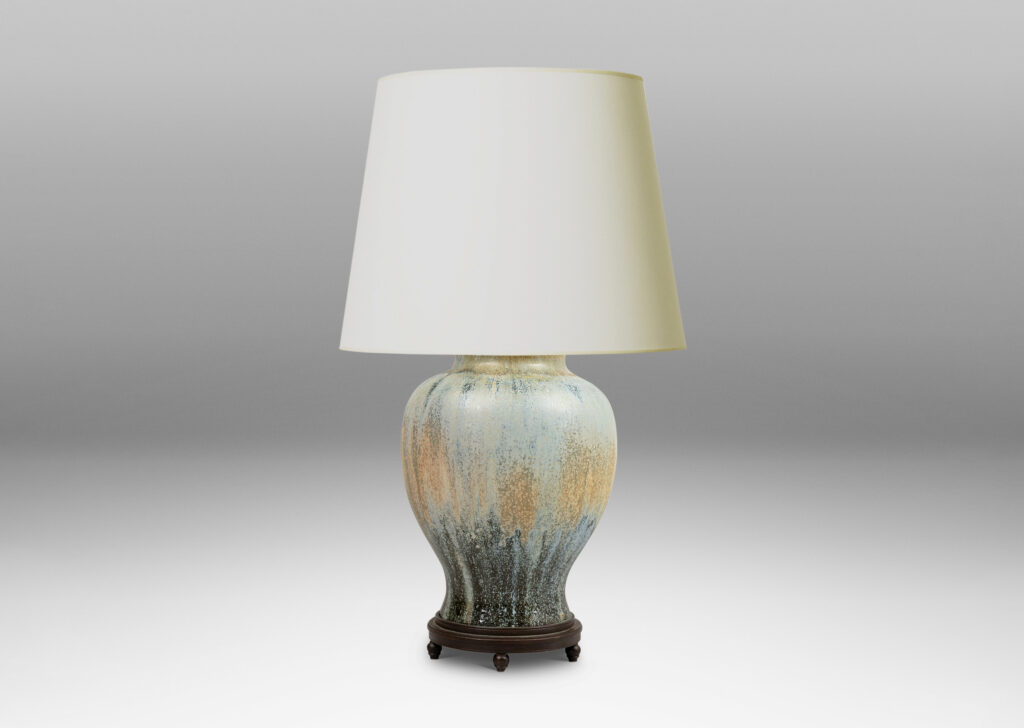 Gallery BAC swelling form glazed in a spectacular flowing ice blue, olive and blue-black, with very fine patinated base with ball feet and top with floating filigree rosette