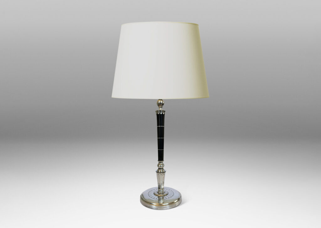 Gallery BAC tapered stand in ebony with pelmeted cap and rosette ornamented base; silver and wood