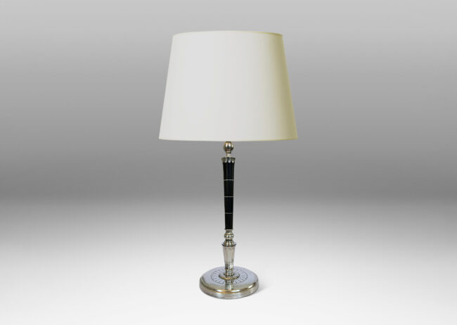 Gallery BAC tapered stand in ebony with pelmeted cap and rosette ornamented base; silver and wood