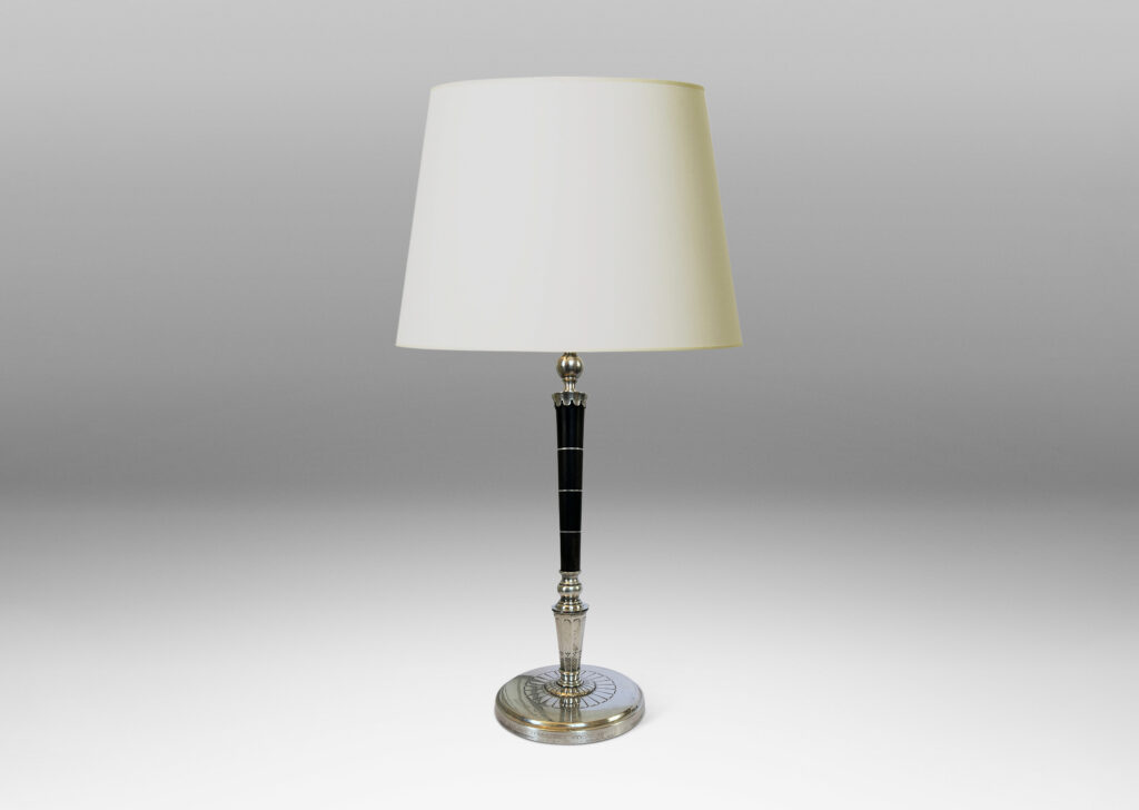 Gallery BAC tapered stand in ebony with pelmeted cap and rosette ornamented base; silver and wood