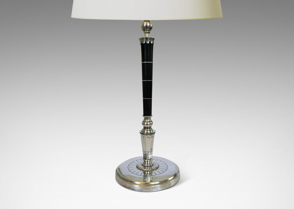Gallery BAC tapered stand in ebony with pelmeted cap and rosette ornamented base; silver and wood