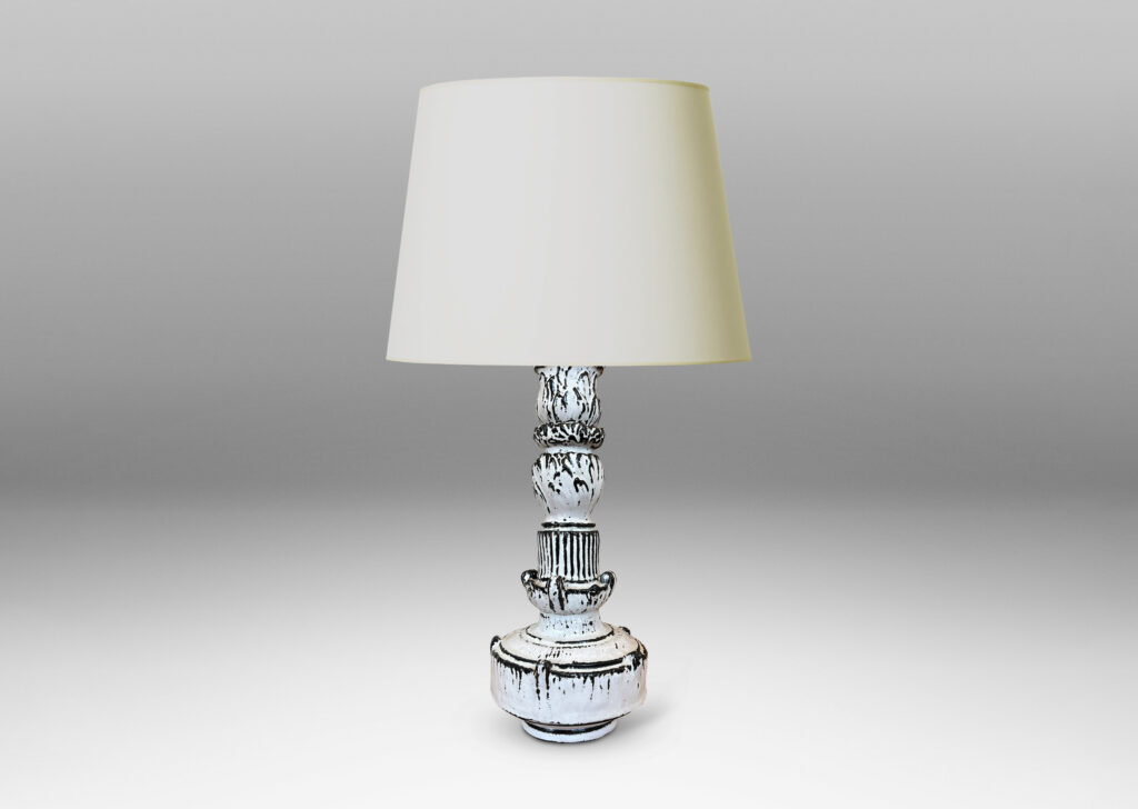 Gallery BAC tiered forms carved with balls of acanthus leave, bands of strikes and scrolling forms, wonderfully accentuated in a white-black tin glaze